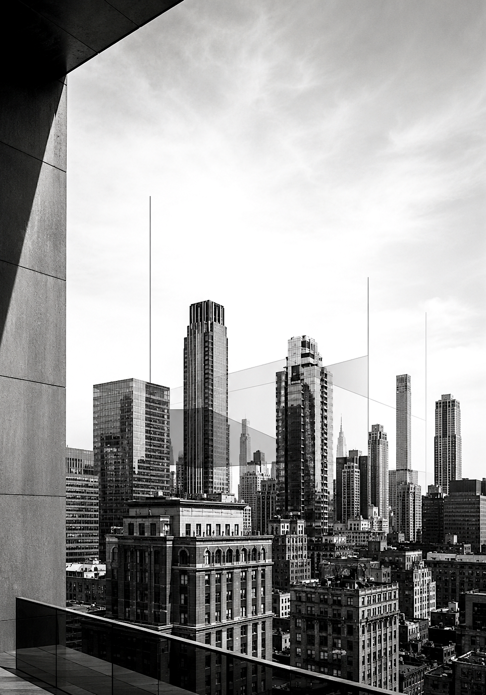 A black and white portrait-oriented New York City skyline viewed from an architectural terrace